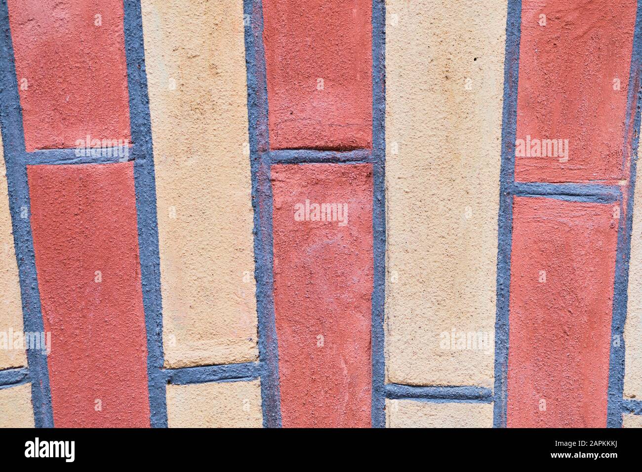 Muro di mattoni di tonalità bianche e rosse vicino Foto Stock