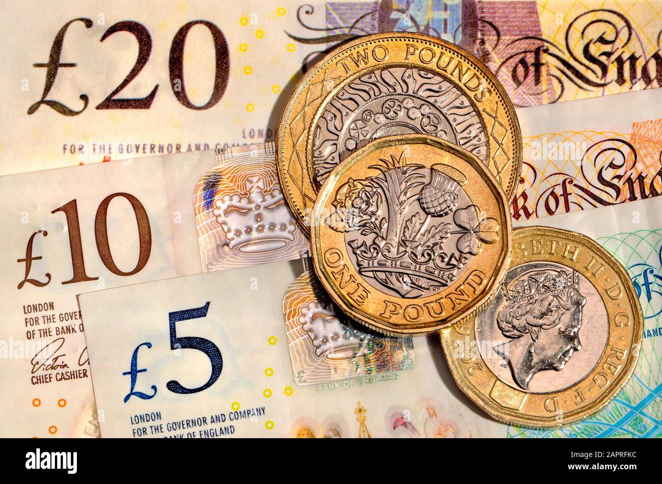 Valuta britannica - monete e banconote Foto Stock