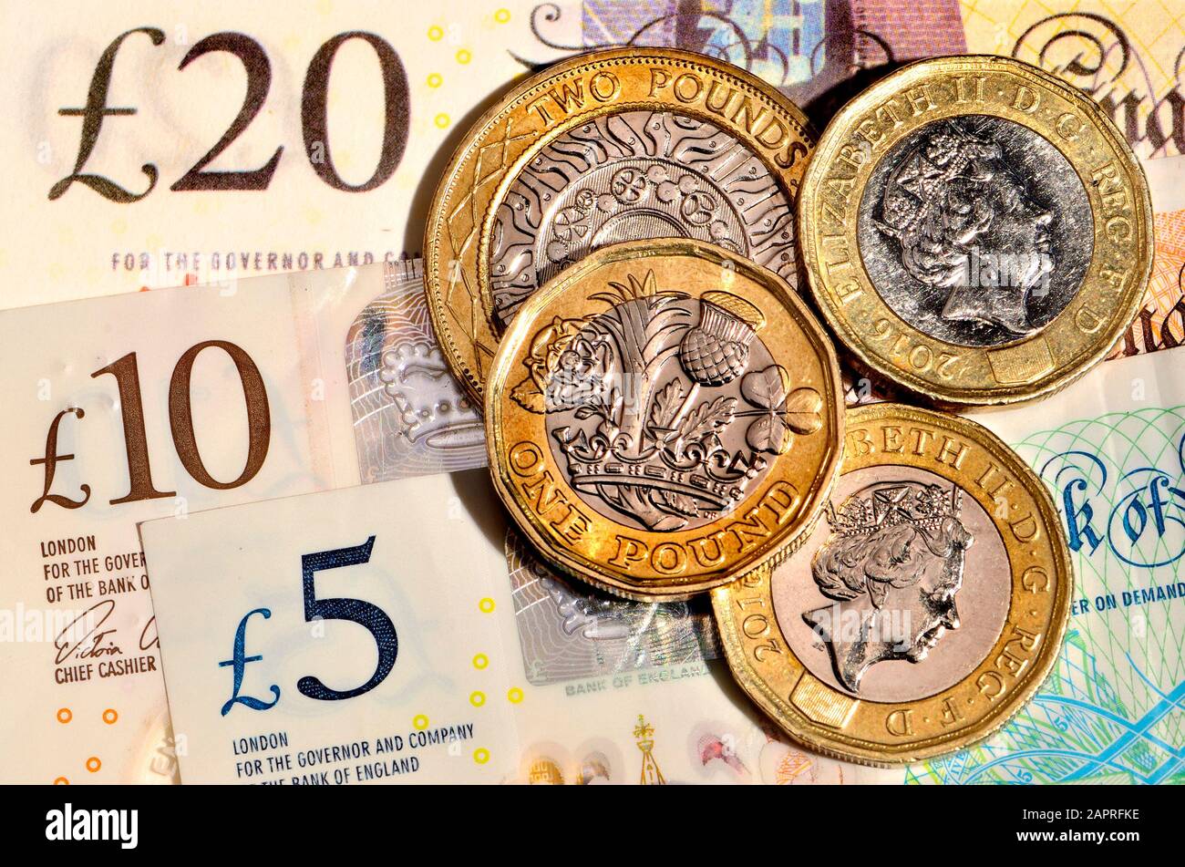 Valuta britannica - monete e banconote Foto Stock