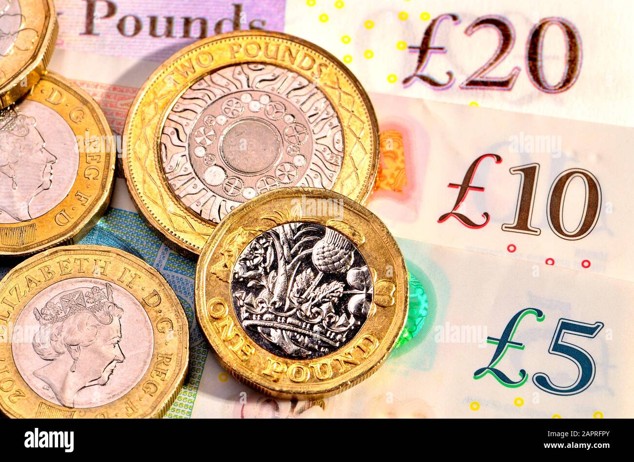 Valuta britannica - monete e banconote Foto Stock