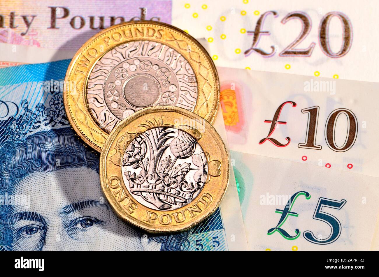 Valuta britannica - monete e banconote Foto Stock