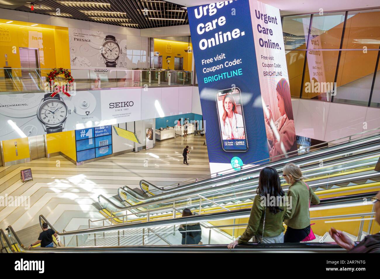 Miami Florida, Virgin MiamiCentral, centro di trasporto della stazione ferroviaria a uso misto, interno, interno, hall, scala mobile, marketing discl Foto Stock