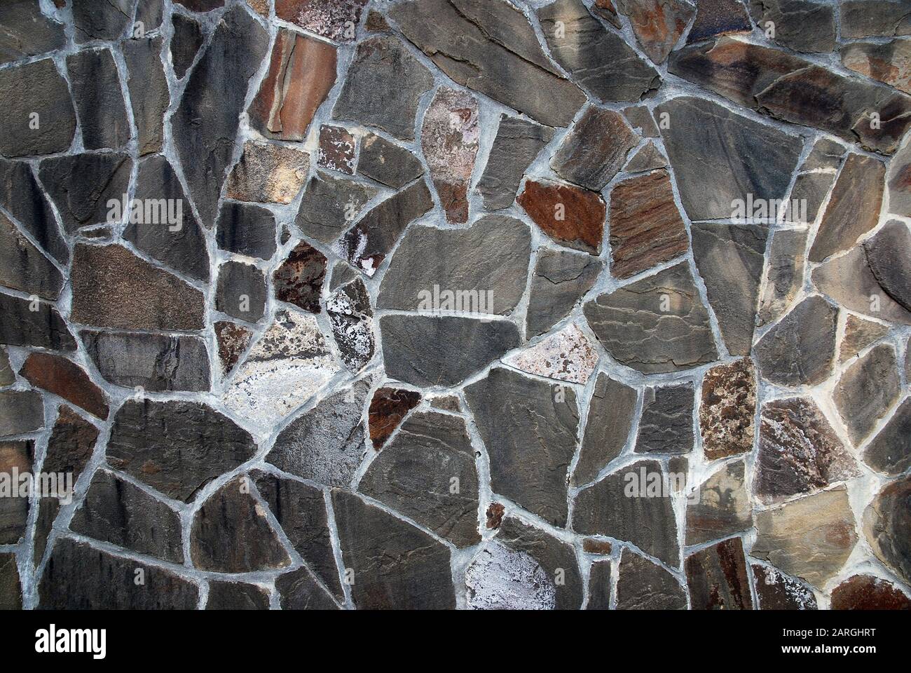 Muro di pietra naturale mosaico texture Foto Stock