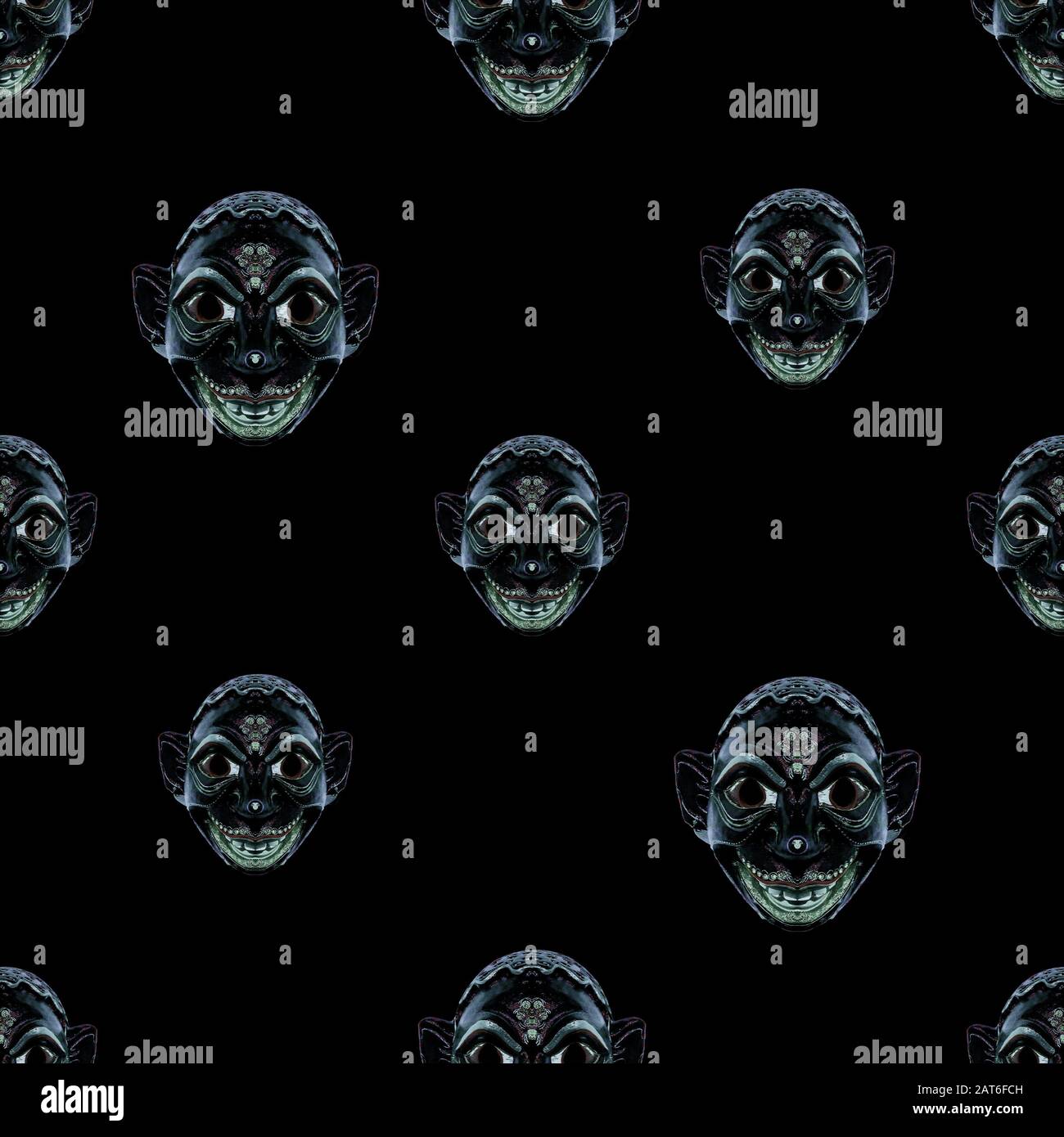 Design del modello senza cuciture conversazionali con motivo della testa della maschera etnica in colori blu scuro e nero Foto Stock