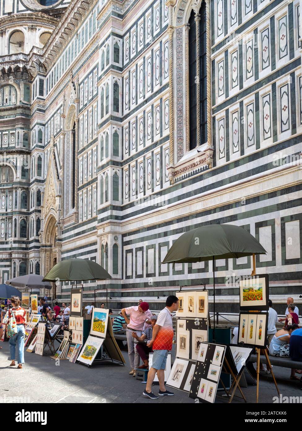 Artisti di strada disegnano ritratti turistici del Duomo di Firenze Foto Stock