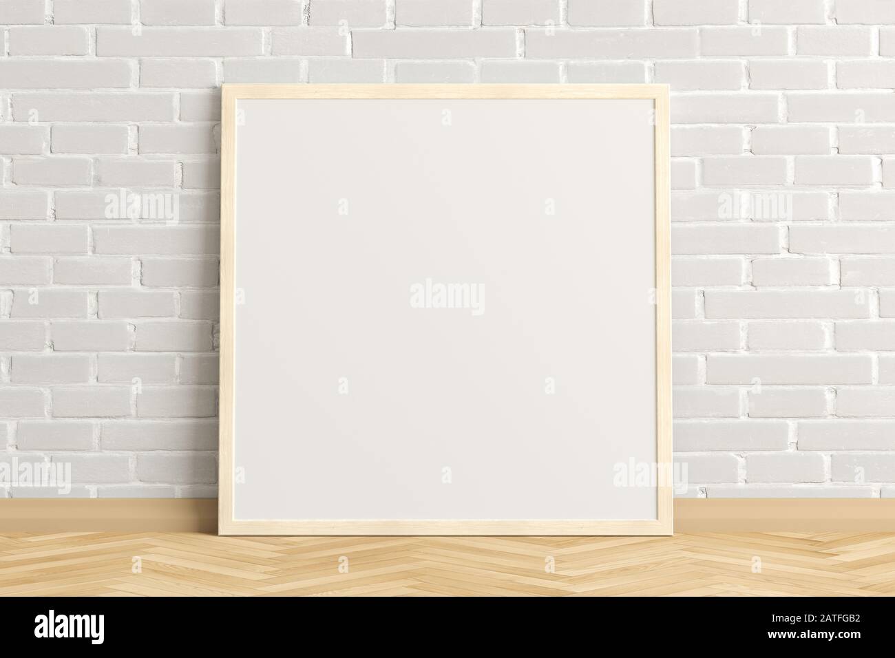 Cornice quadrata vuota per poster su pavimento in parquet chiaro a spina di pesce accanto alla parete bianca in mattoni. Tracciato di ritaglio intorno al poster Foto Stock