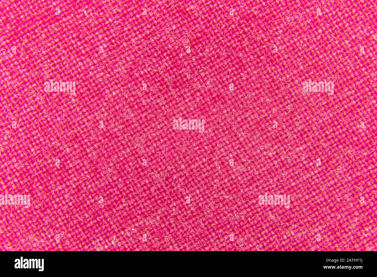 Primo piano immagine di interlacciamento di tessuto rosa closeup Foto Stock