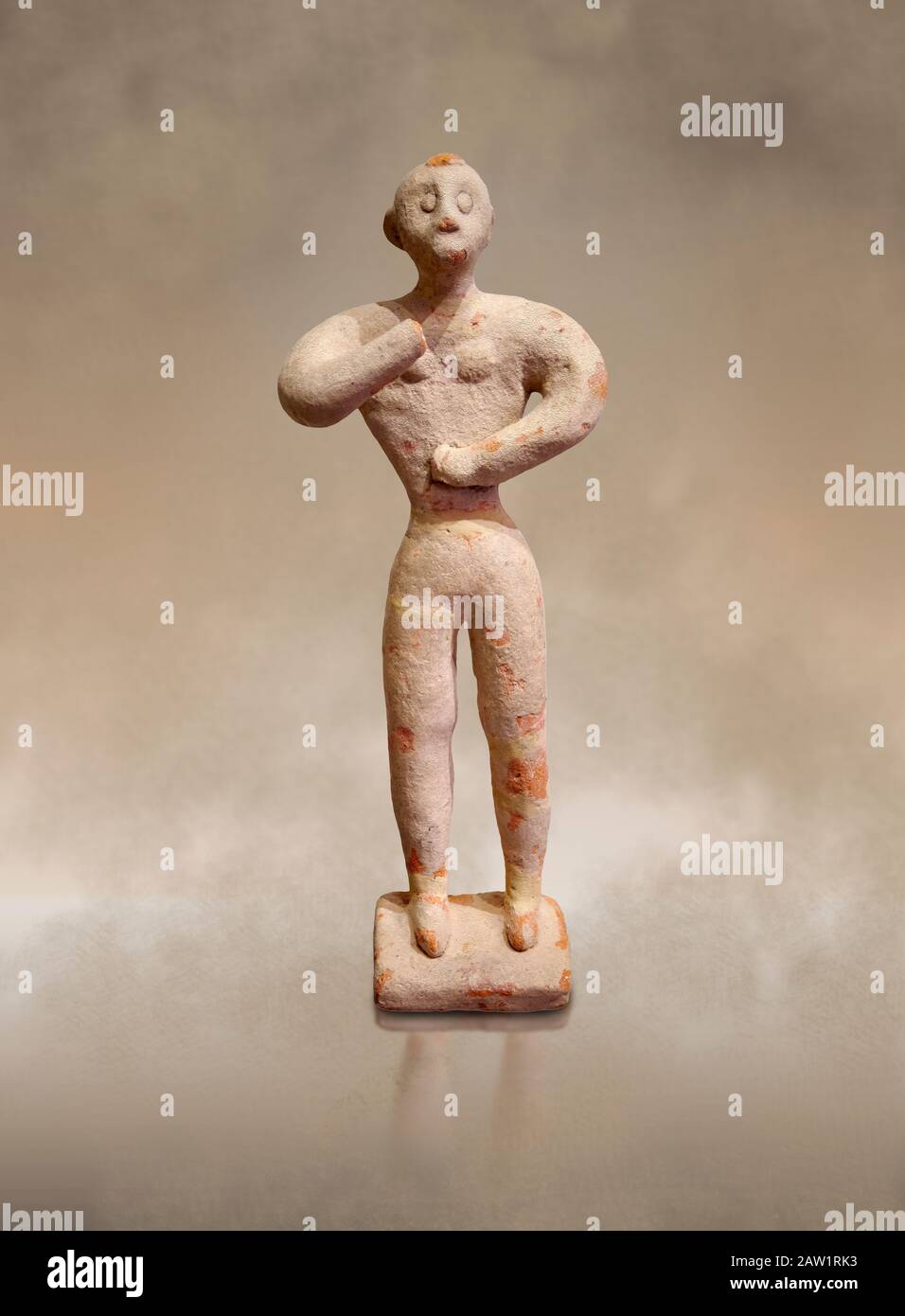 Figurina maschile in argilla minoica nell'atteggiamento di culto, Chamezi 1900-1700 a.C.; Museo Archeologico di Heraklion. Foto Stock
