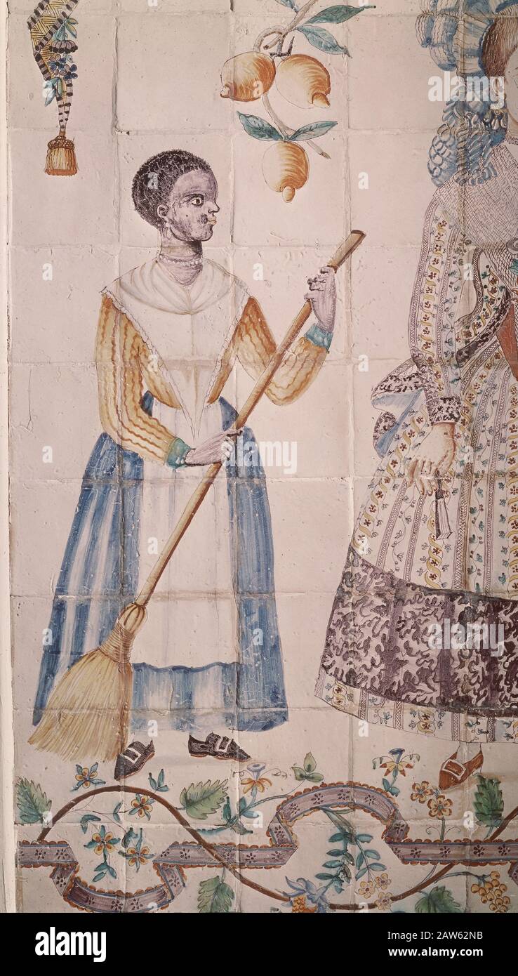 COCINA VALENCIANA CON AZULEJOS DE MANISES - SIGLO XVIII - ARTES APLICADAS - DETALLE DE UNA SIRVIENTA DE RAZA NEGRA. LOCATION: ITALY. MADRID. SPAGNA. VERGINE MARIA. Foto Stock