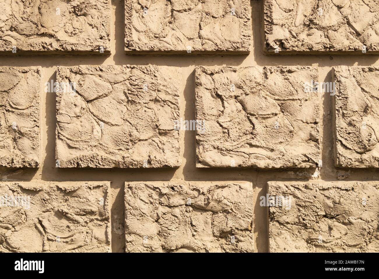 Vecchio muro di mattoni di fondo. Muro di mattoni quadrati. Crepe muro di pietra texture Foto Stock