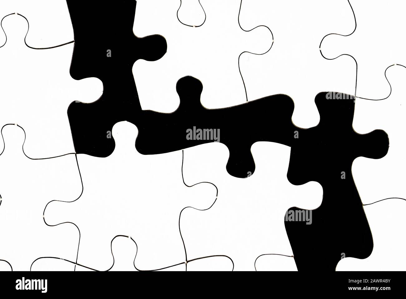 Illustrazione di pezzi in bianco e nero di un puzzle Foto Stock