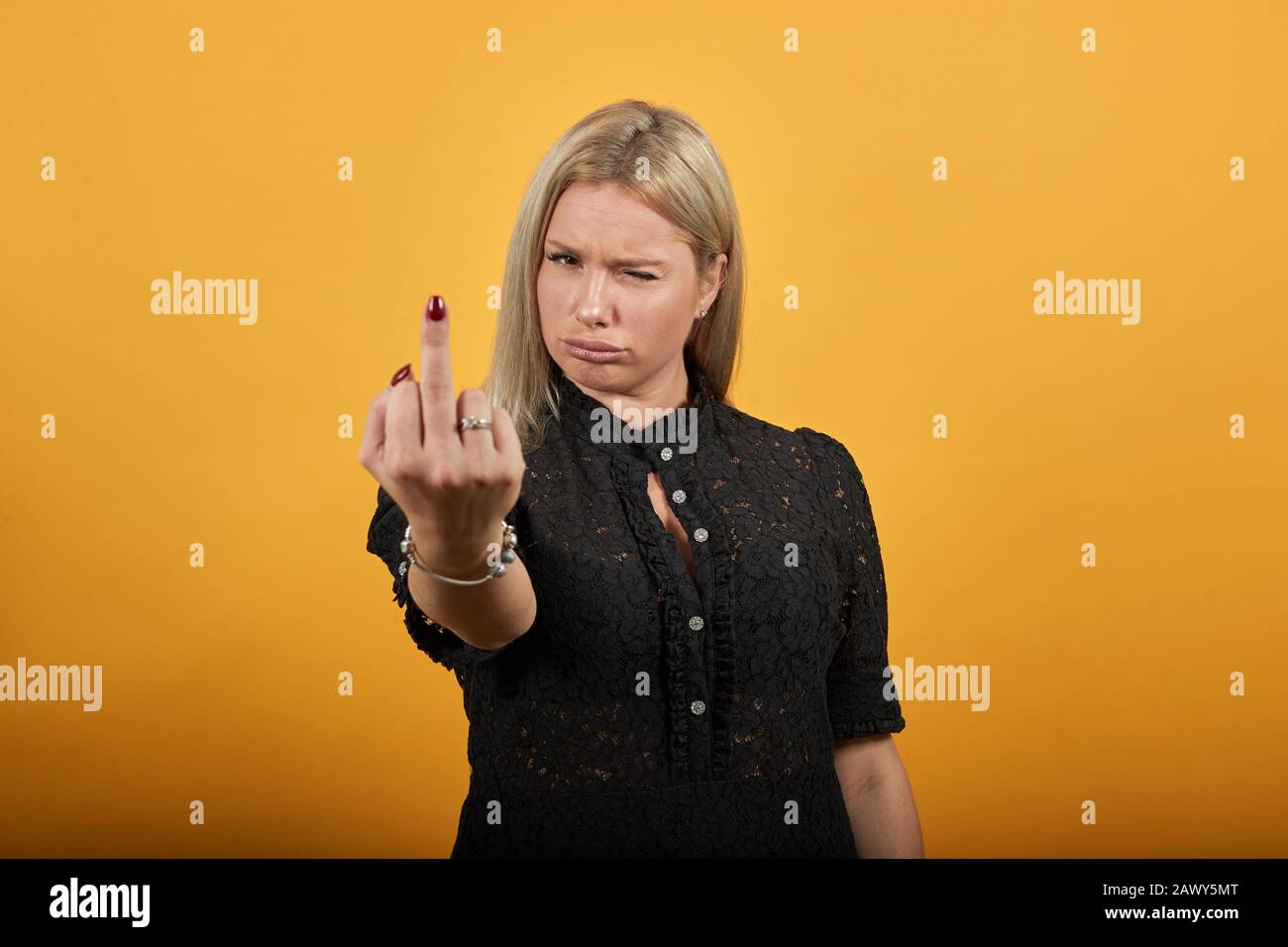 Woman shows middle finger immagini e fotografie stock ad alta