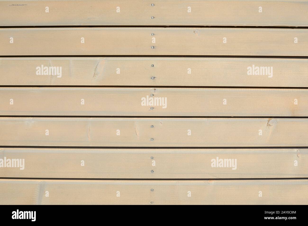 Sfondo in legno con plance orizzontali alla luce del sole Foto Stock