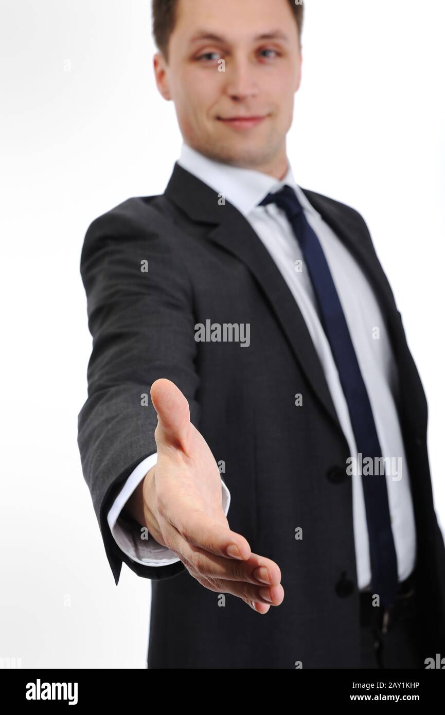 Imprenditore che si estende la mano per agitare Foto Stock