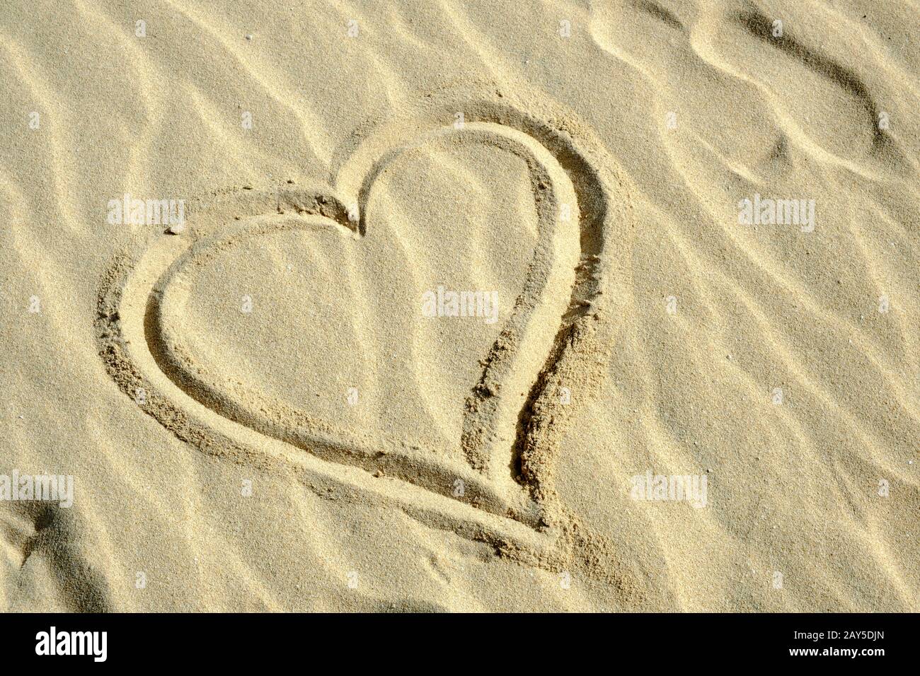 L'amore è nella sabbia Foto Stock
