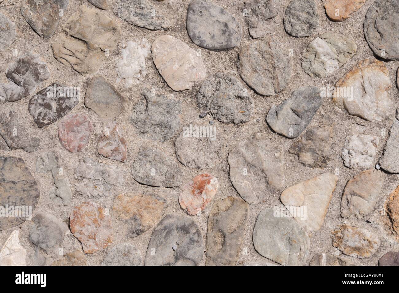 Pavimento in pietra o parete in pietra come sfondo e spazio di testo Foto Stock