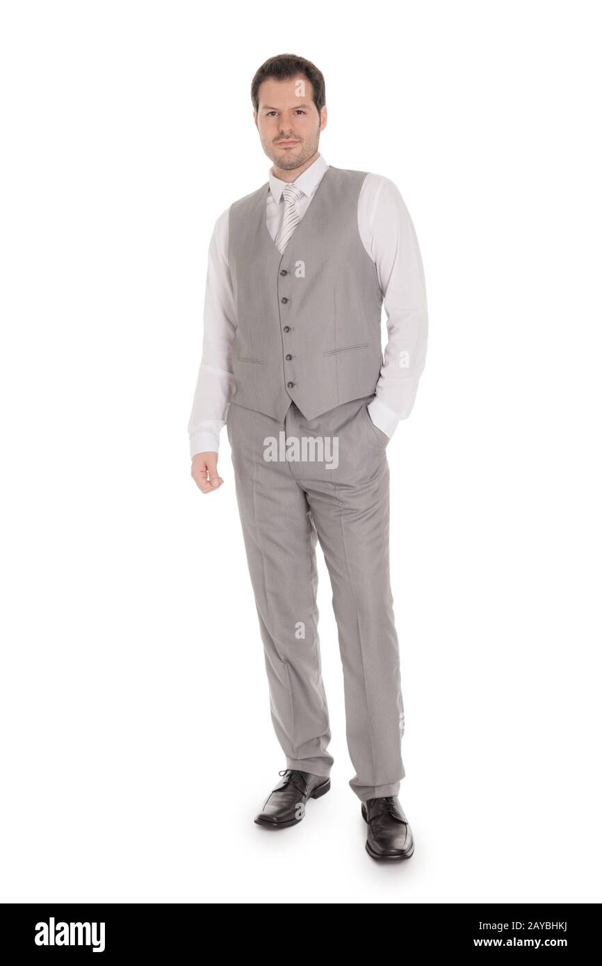 Uomo con grigio brillante suit isolati su sfondo bianco. Business e concetto di matrimonio. Foto Stock