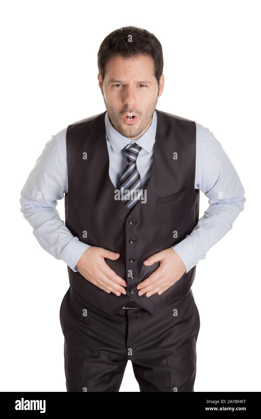 Uomo con mal di stomaco isolato su sfondo bianco. Foto Stock