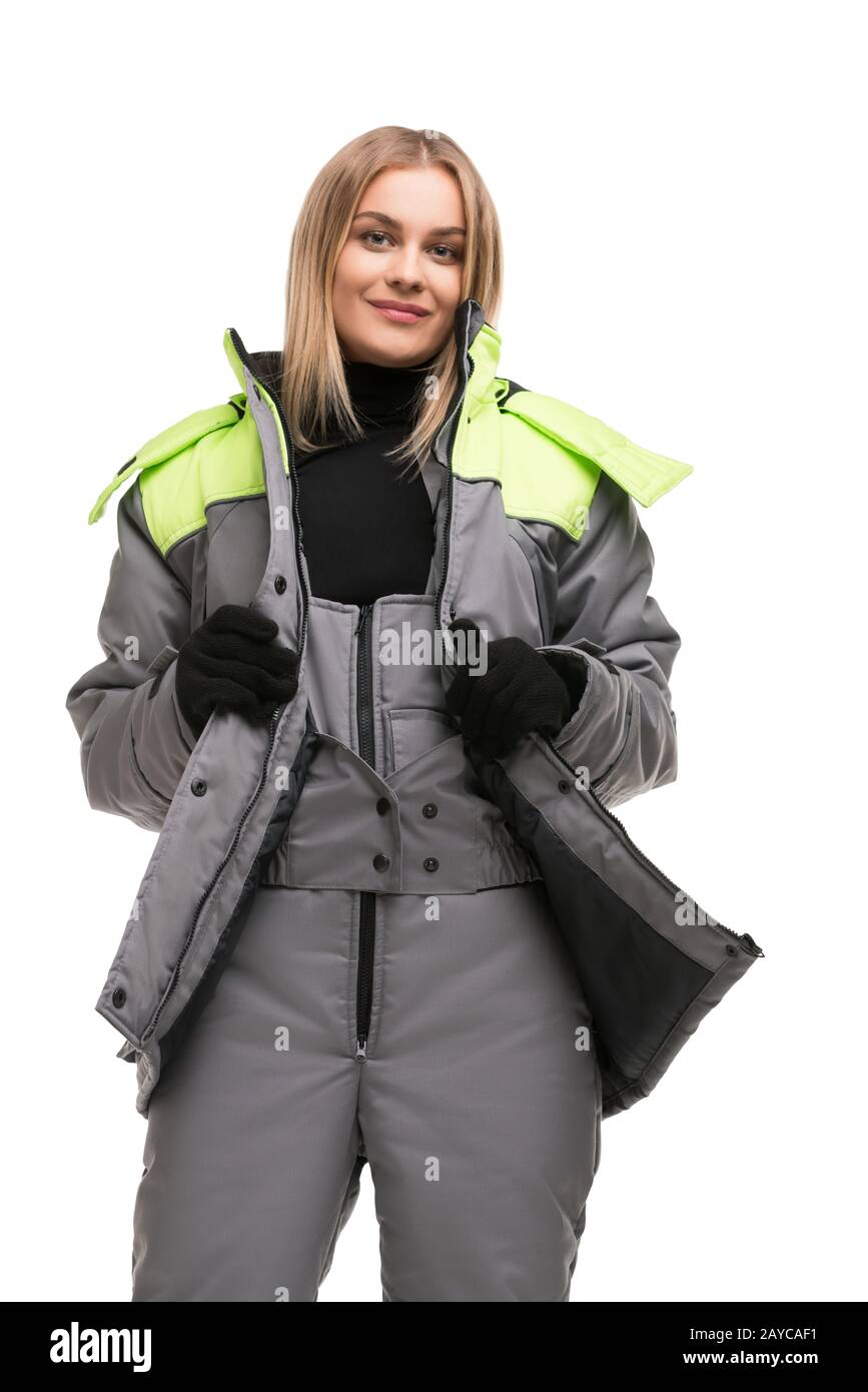 Bionda in abiti da lavoro e guanti vista isolata Foto Stock