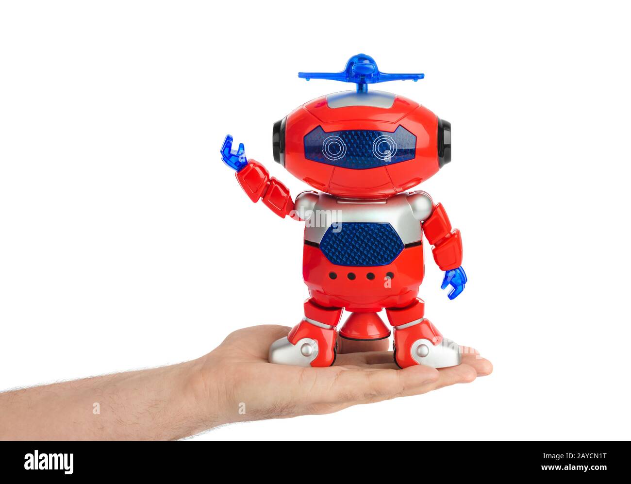 Mano con robot giocattolo Foto Stock