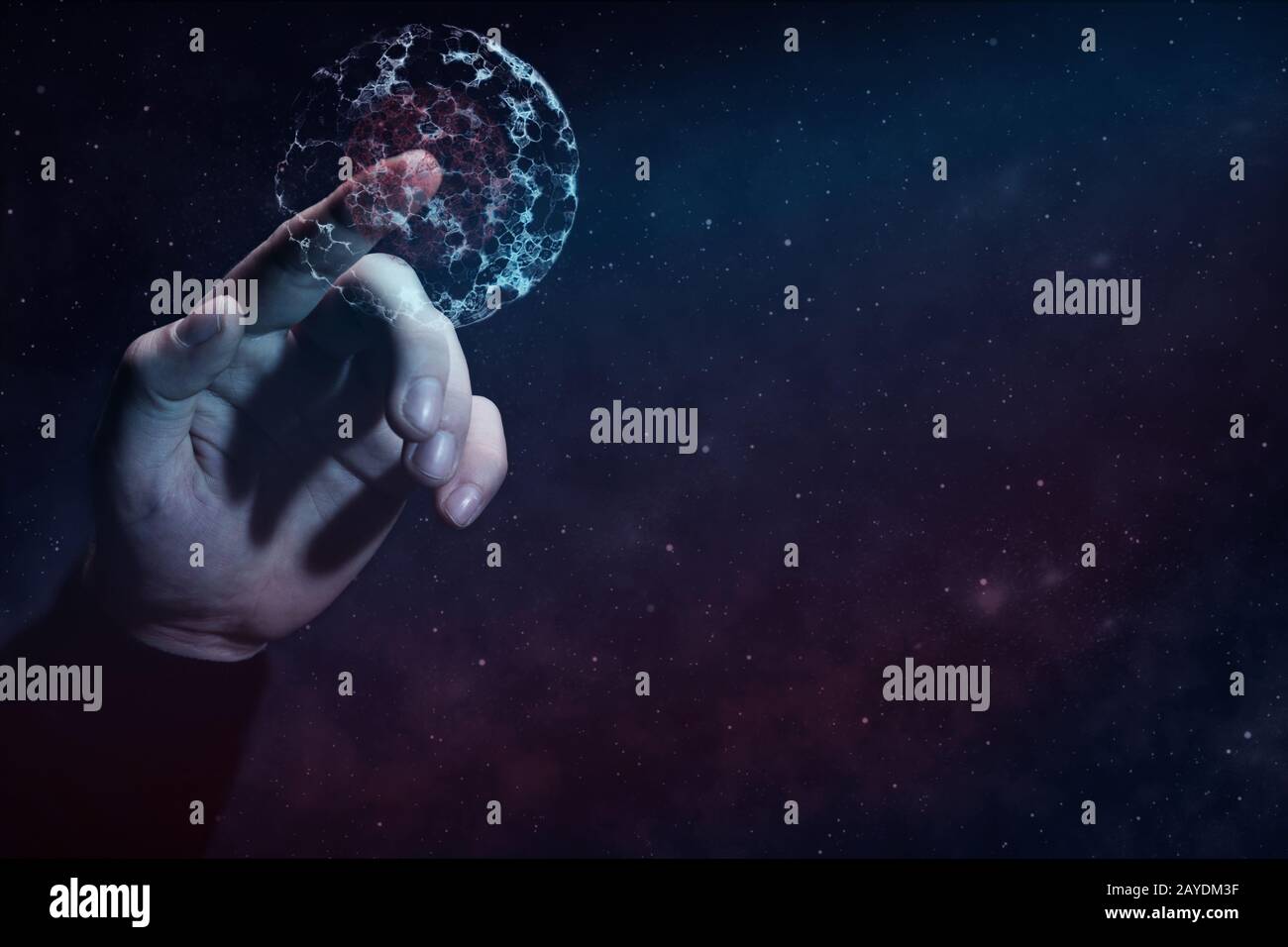 L'indice umano tocca la divisione cellulare. Polvere nebulosa in spazio infinito. Supporti misti. Foto Stock