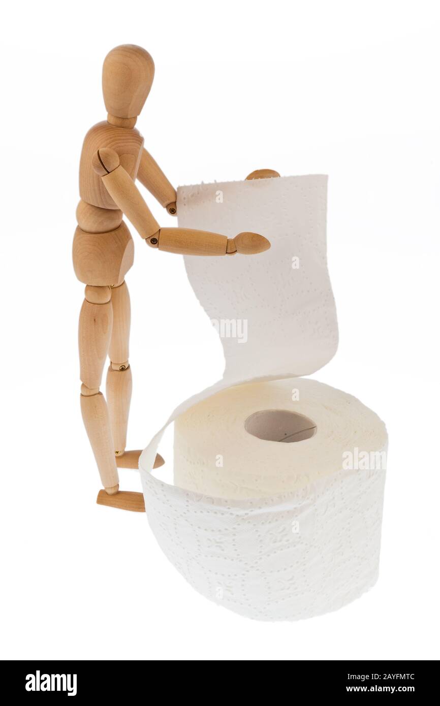 Eine Holzfigur und eine Rolle Toilettenpapier Foto Stock