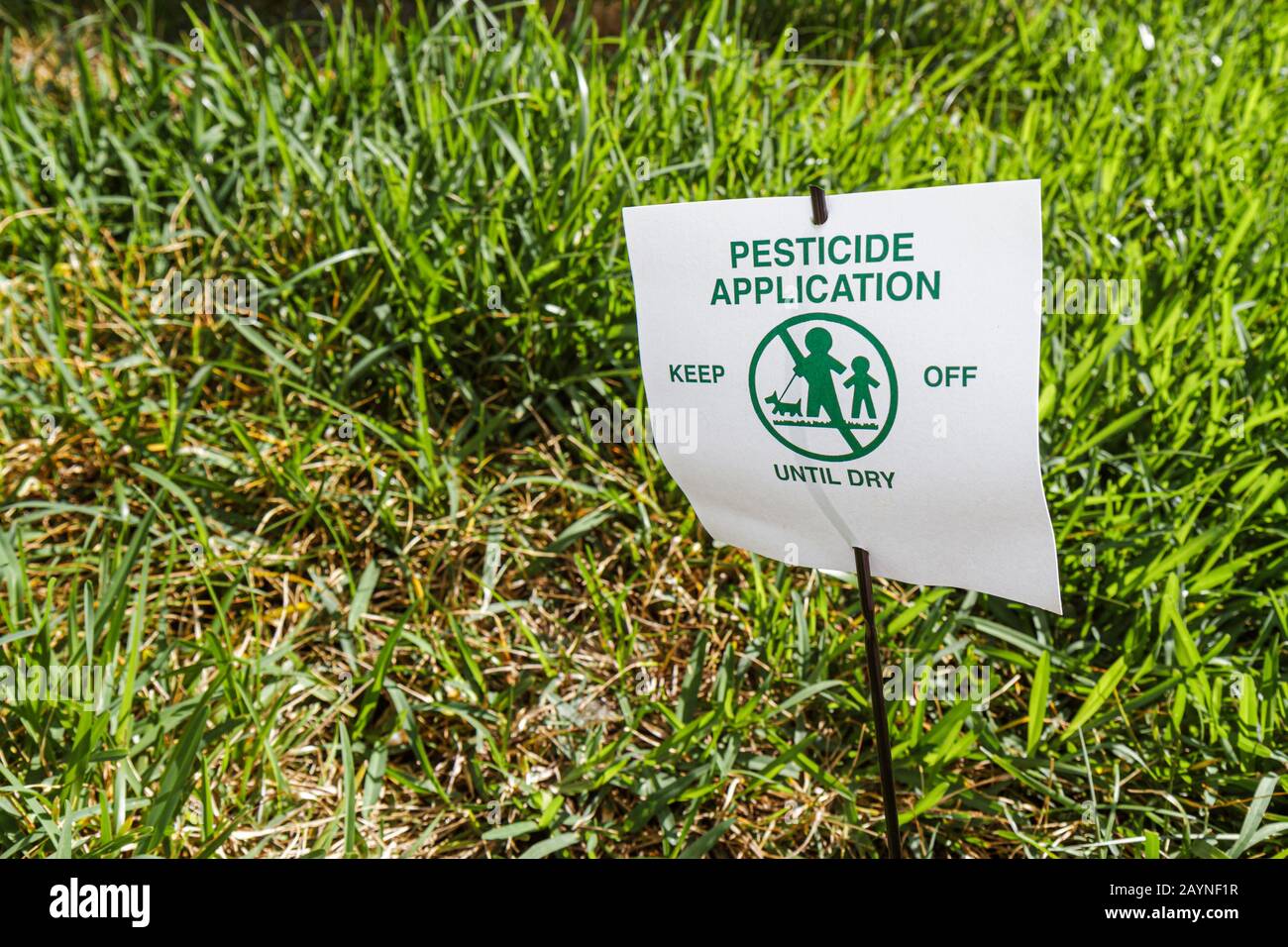 Miami Beach Florida, pesticida applicazione segno di avvertimento simbolo erba, Foto Stock