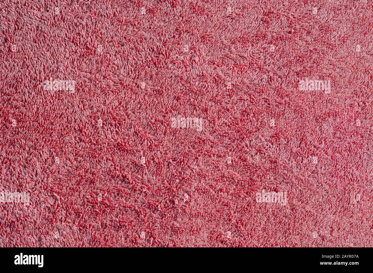 Sfondo astrazione. Tessuto di spugna rossa. Foto Stock