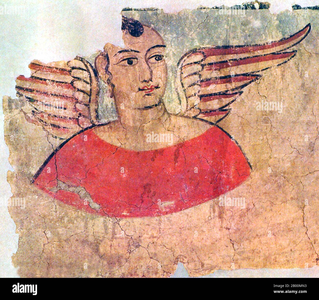 Cina: Murale di un angelo alato di Miran, Xinjiang. In tempi antichi Miran era un trafficato centro commerciale sulla parte meridionale della Via della Seta, dopo che il percorso si è diviso in due (la rotta nord e la rotta sud), come carovane di mercanti cercato di sfuggire viaggiare attraverso la dura terra desolata del deserto (Chiamato dai cinesi 'il mare della morte') e il bacino di Tarim. Andarono girando intorno al suo bordo nord o sud. Era anche un fiorente centro del buddismo con molti monasteri e stupidi. Marc Aurel Stein fu il primo archeologo a studiare sistematicamente le rovine di Miran nel 1907. Foto Stock