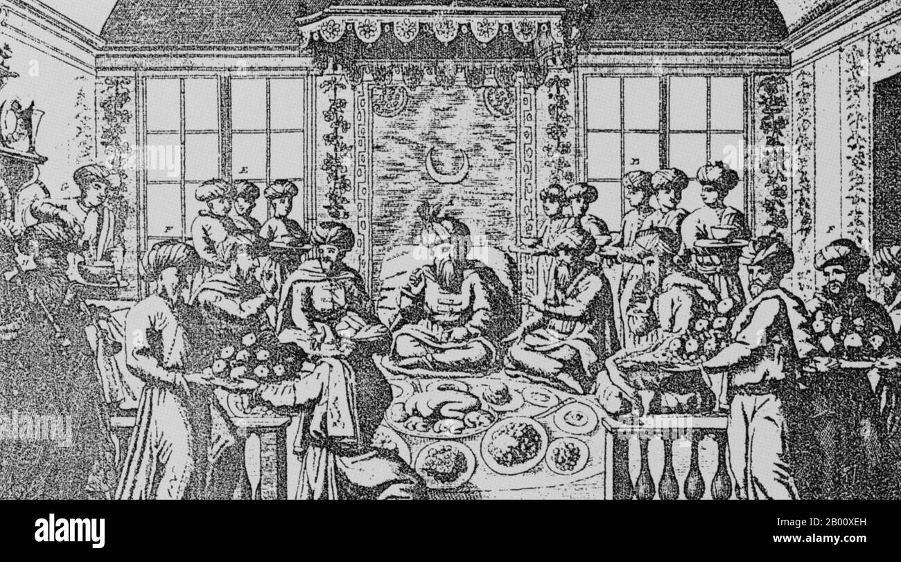 Francia/Turchia: Mehmet Efendi, che nel 1720 divenne il primo ambasciatore ottomano a Parigi, viene servito un pasto sontuoso da circa 20 servitori. Yirmisekiz Celebi Mehmet Efendi fu un ispettore militare degli eserciti ottomani che divenne diplomatico e fu selezionato dal sultano Ahmed III come primo ambasciatore dell'impero nella Francia di Loius XV. Fu anche poeta che scriveva con il nome di penna ‘Faizi’. Ha scritto un interessante resoconto delle sue esperienze in Francia nel libro turco dei viaggi diplomatici, ‘Sefaretname’. Foto Stock