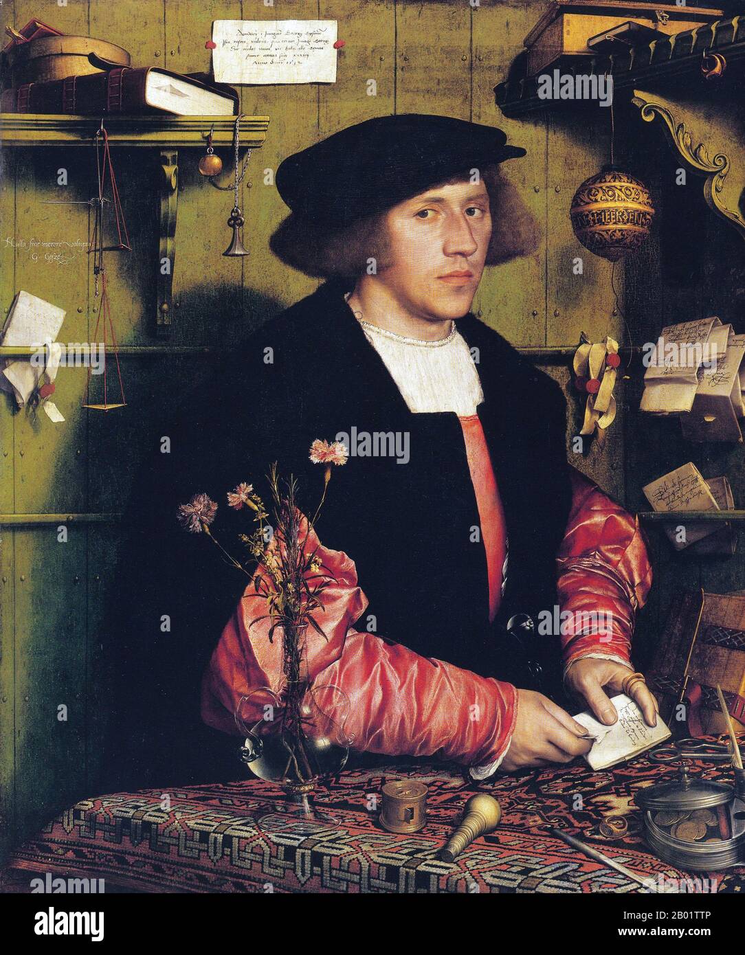 Germania: "Il mercante Georg Gisze". Olio su legno dipinto di Hans Holbein il giovane (1497-1543), c. 1532. Hans Holbein il giovane era un pittore e incisore tedesco-svizzero dello stile rinascimentale settentrionale, visto da molti come uno dei più grandi ritrattisti del XVI secolo. La sua gamma di lavori includeva anche la propaganda della riforma, l'arte religiosa e la satira, e fu un influente contributore alla storia del design del libro. Fu anche pittore del re di Enrico VIII d'Inghilterra, i suoi ritratti della famiglia reale e della nobiltà un'importante testimonianza superstite della corte inglese. Foto Stock