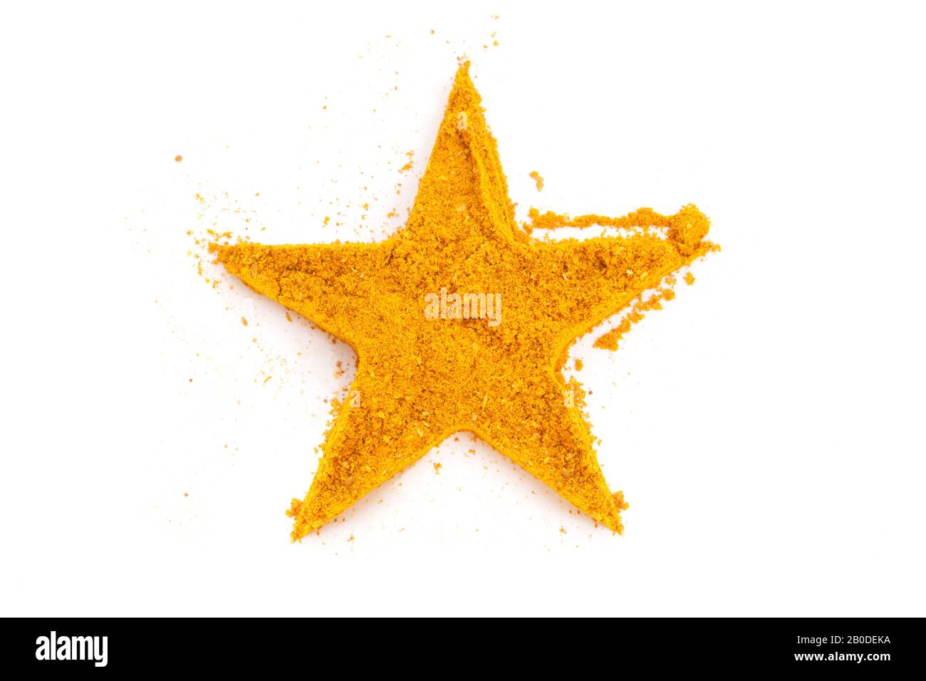 Heap Ground Curry (Madras Curry) isolato a forma di stella su sfondo bianco. Usato come spezia nelle cucine di tutto il mondo. Foto Stock