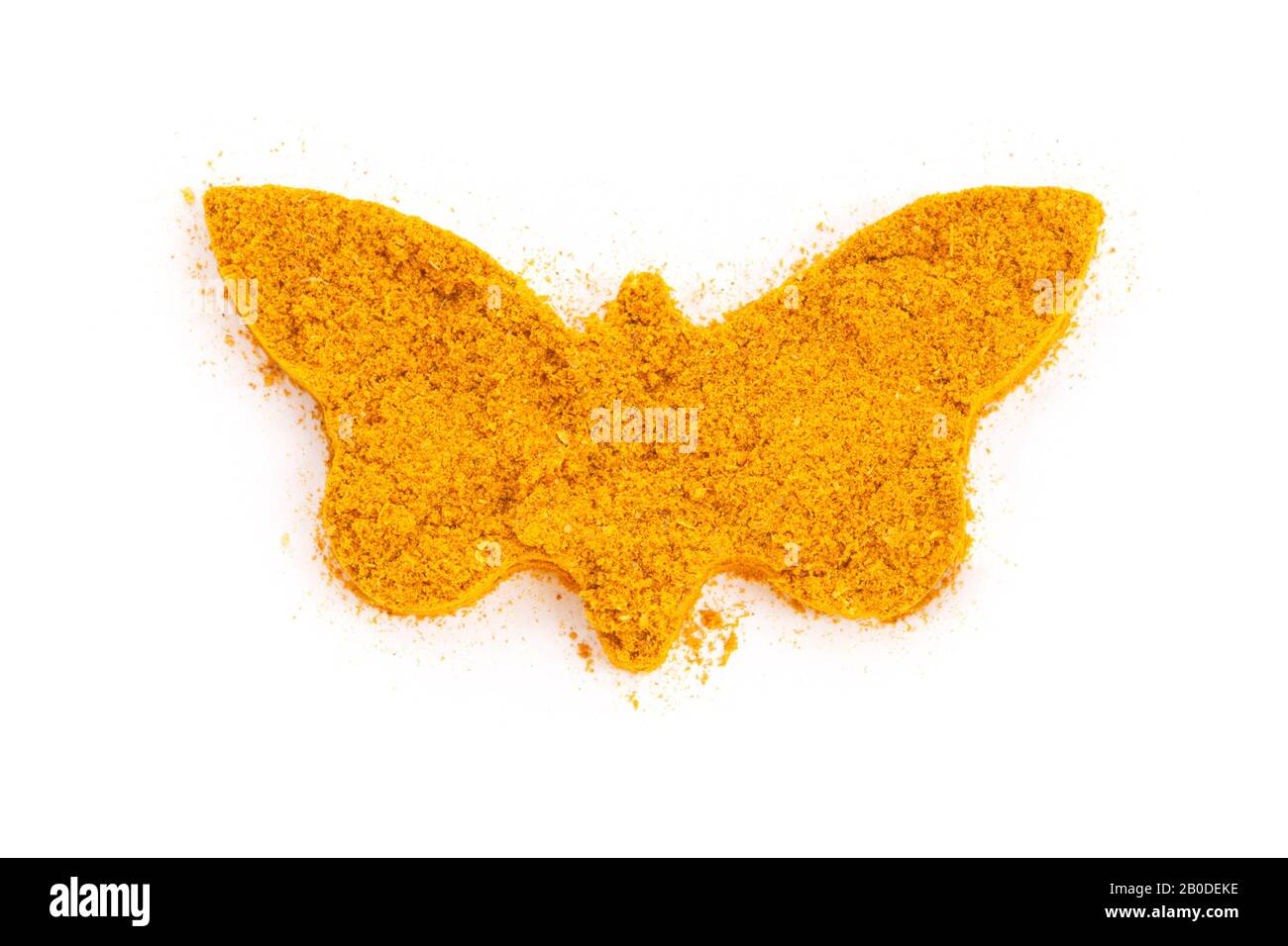 Heap Ground Curry (Madras Curry) isolato a forma di farfalla su sfondo bianco. Usato come spezia nelle cucine di tutto il mondo. Foto Stock