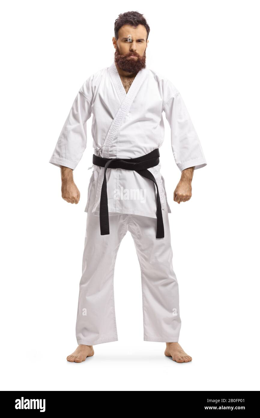Ritratto a tutta lunghezza di un uomo con bearded che indossa un kimono karate e una cintura nera isolata su sfondo bianco Foto Stock