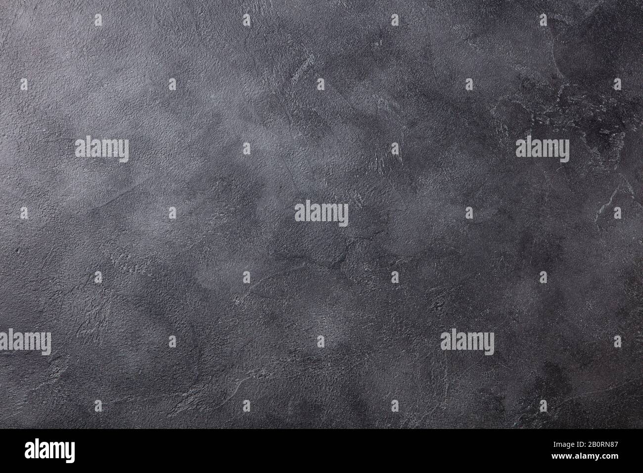 Motivo di fondo in ardesia nera naturale con alta risoluzione. Vista dall'alto. Spazio di copia. Foto Stock