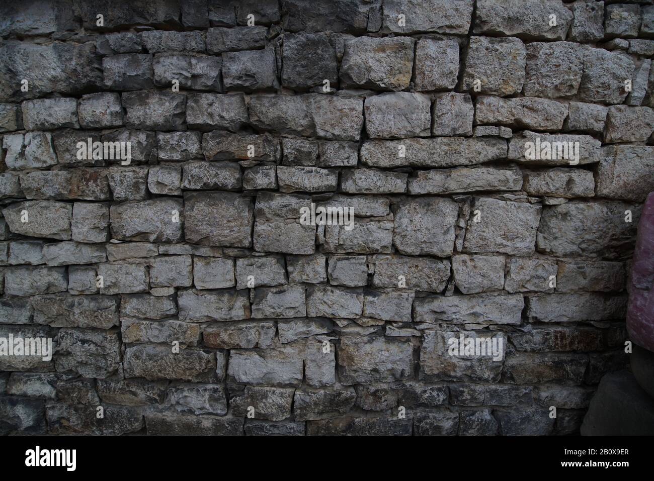 Bruchsteinmauer als Textur Foto Stock