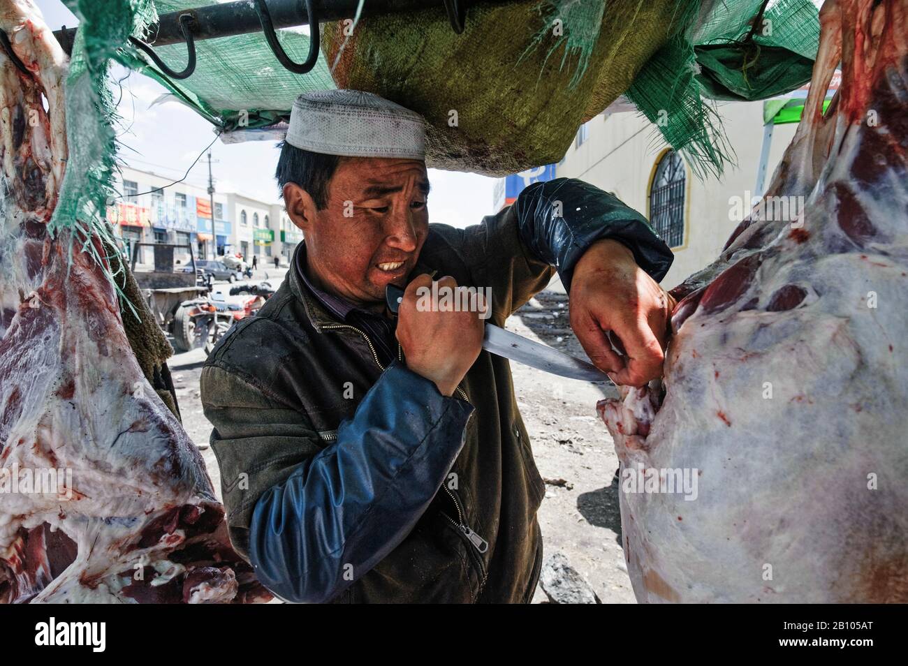 I Musulmani cinesi, il Hui minoranza etnica. Macellaio in Xinning. Cina Foto Stock