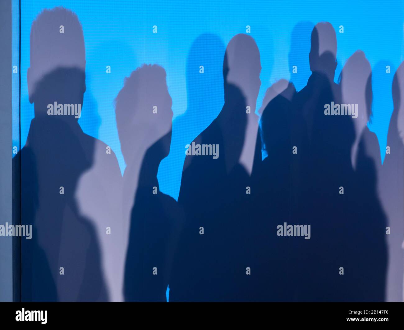 Muro, persone, ombre Foto Stock