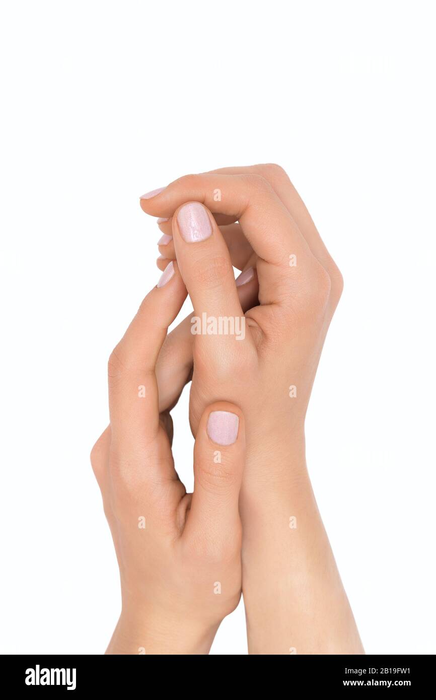 Bella mani femminili isolati su sfondo bianco Foto Stock