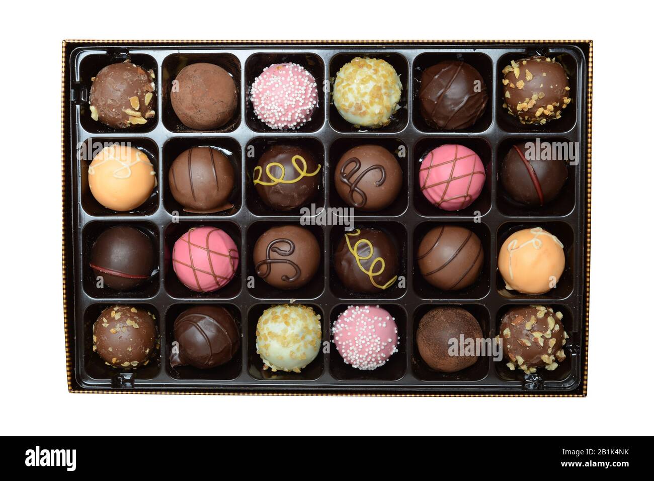 Scatola assortita isolata di cioccolatini a forma di sfera Foto Stock