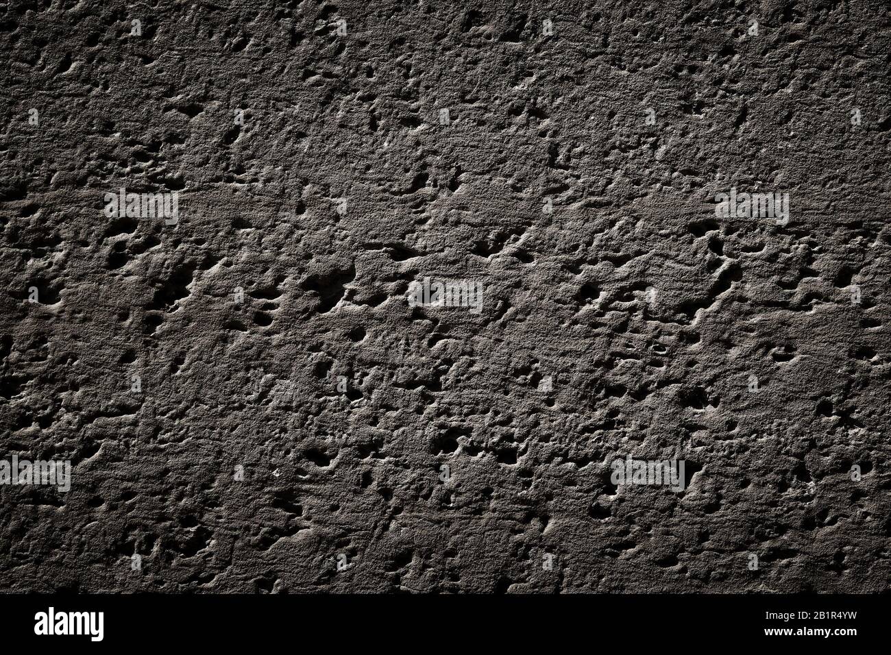 Texture grintosa scura - motivo della superficie della parete grungy. Foto Stock