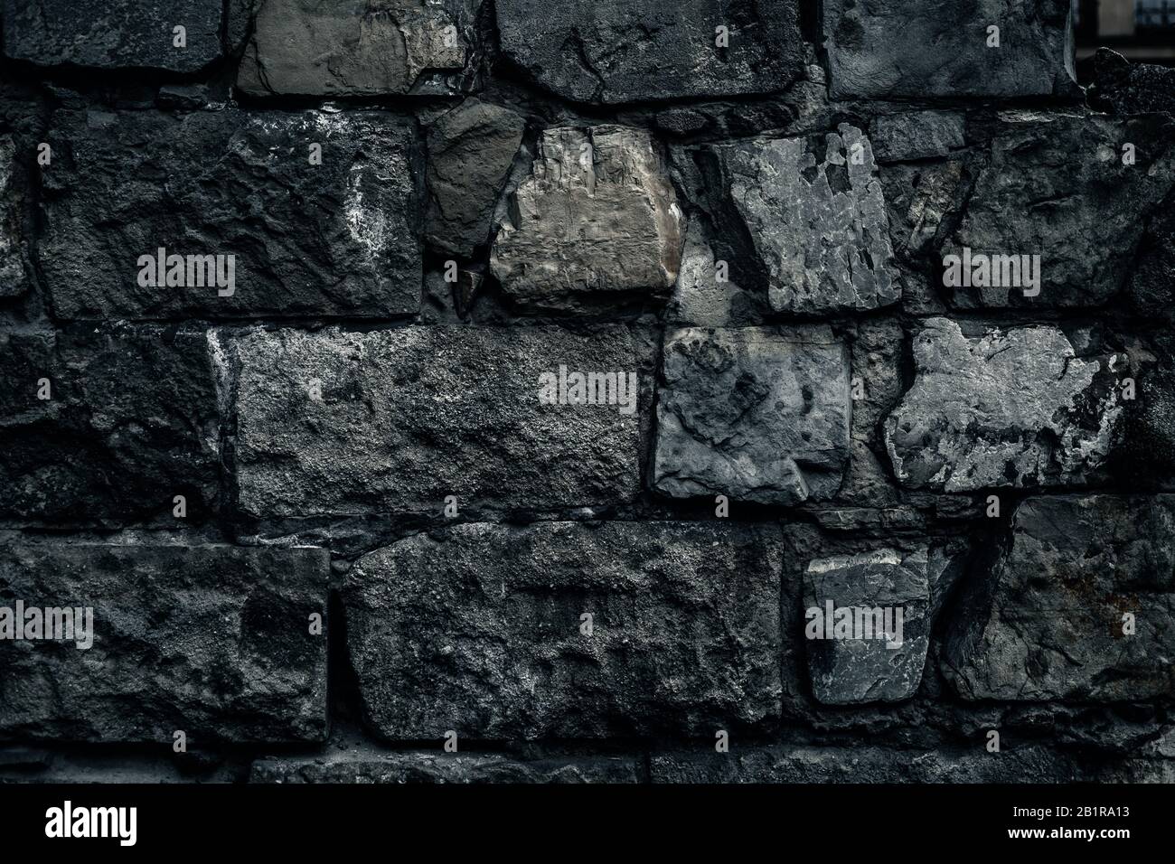 Vecchio muro di pietra sfondo, muro di mattoni grunge texture vicino. Foto Stock