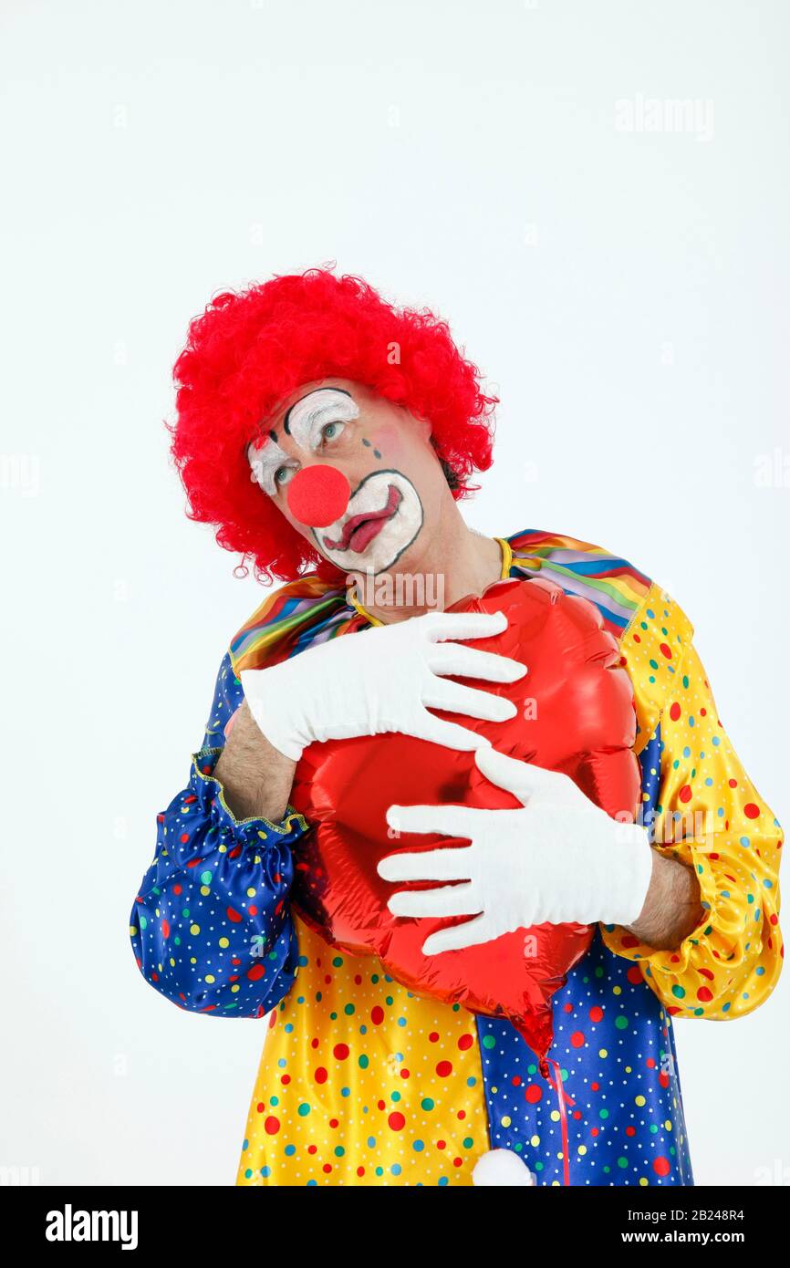 Clown con cuore, malinconico, Germania Foto Stock