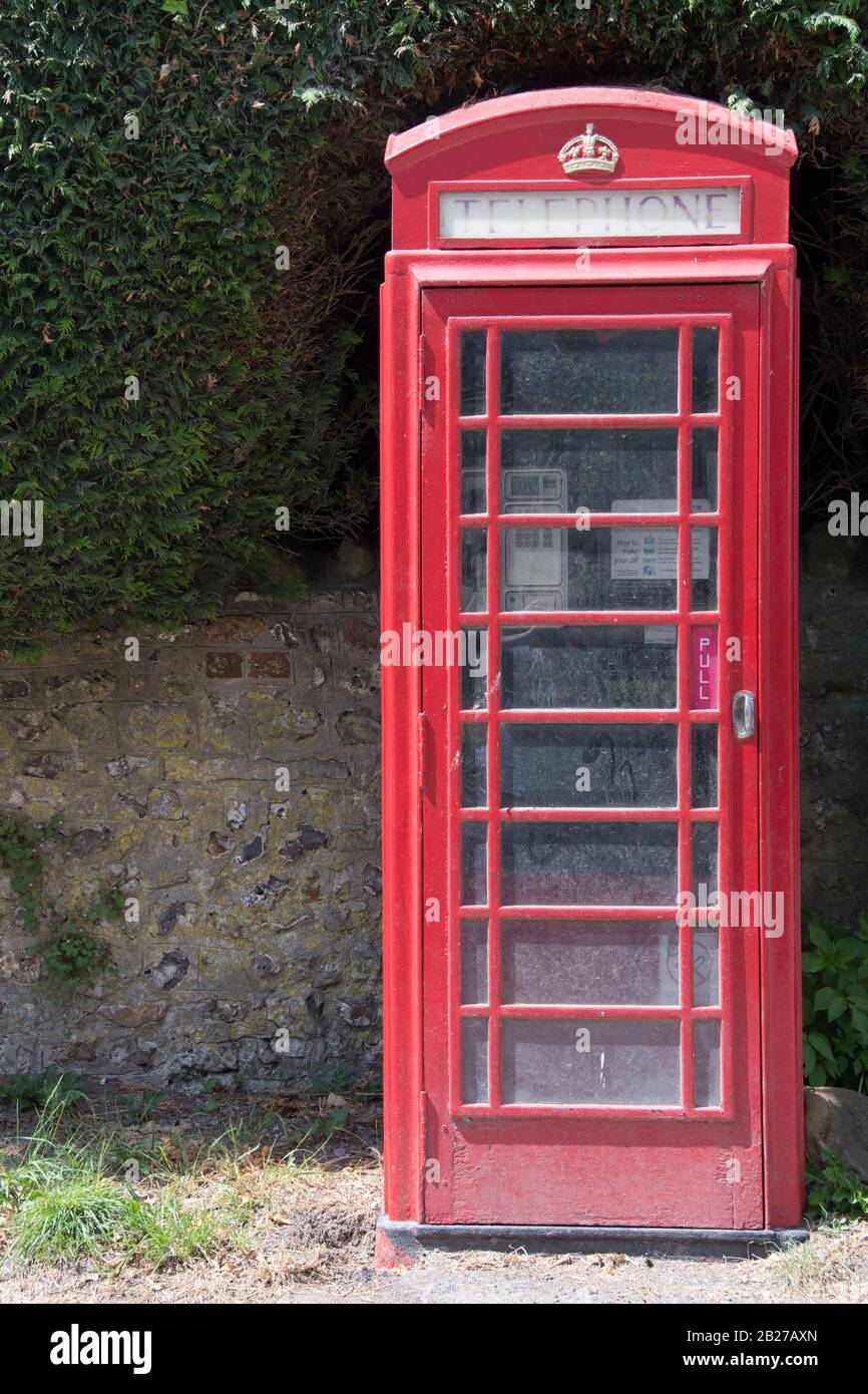 Iconico telefono cellulare British Telecom rosso Foto Stock