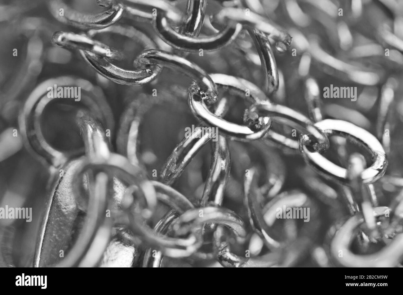 Macro. Le catene fotografiche in bianco e nero si chiudono a schermo intero. Foto Stock