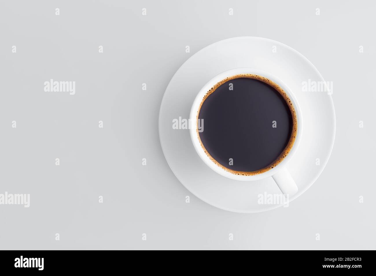 Una tazza da caffè a disposizione piatta su un piattino pieno di caffè nero con schiuma su sfondo grigio con spazio per la copia. Foto Stock