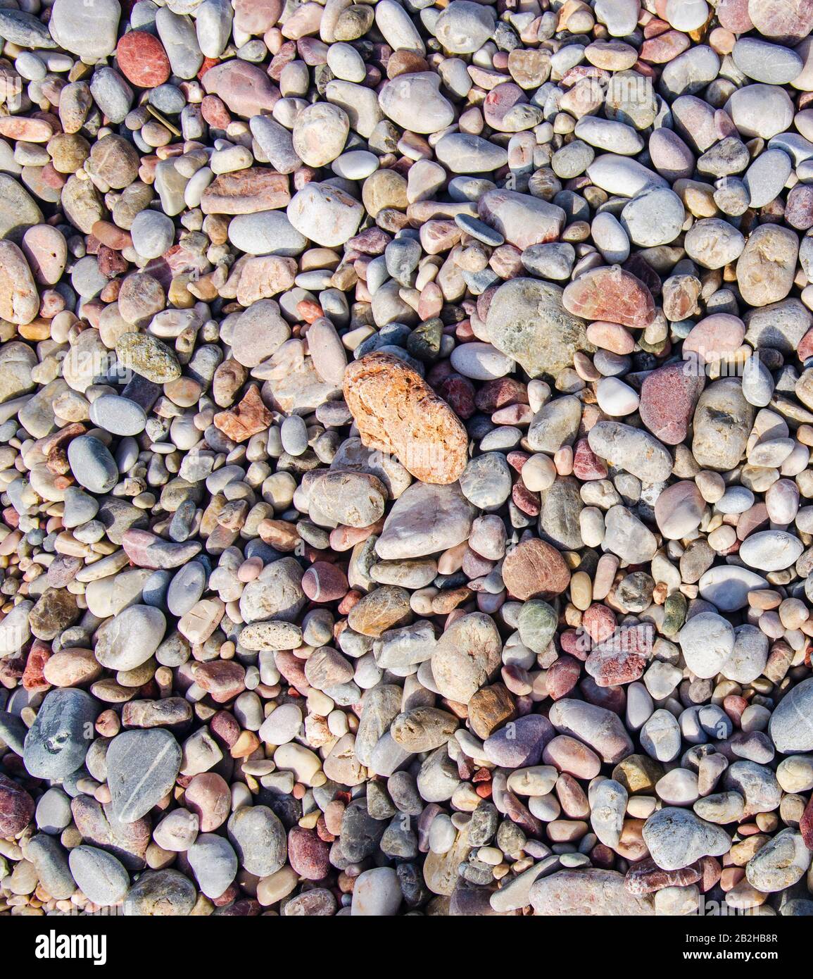 Ciottoli sulla spiaggia, sfondo Foto Stock