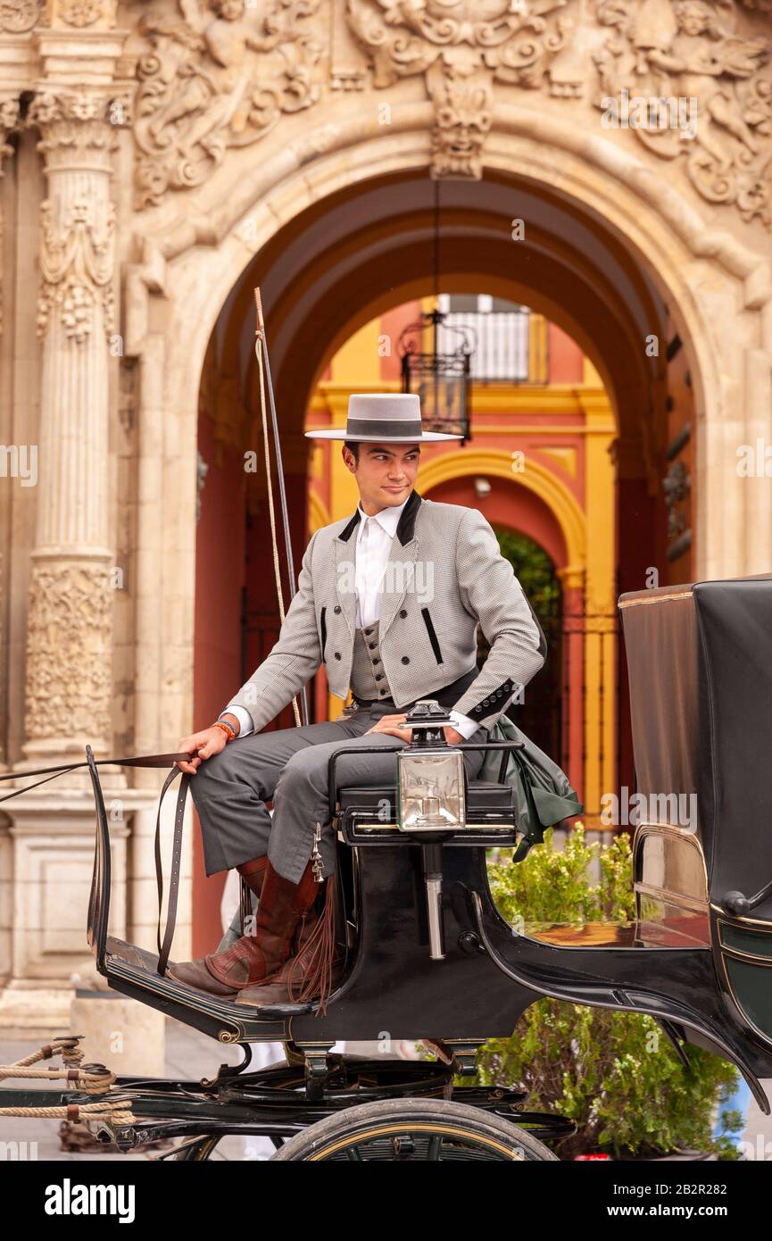 Cavallo e Carrozza driver, Siviglia, Spagna Foto Stock