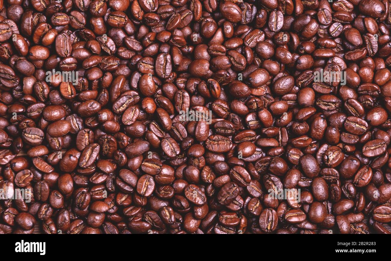 Chicchi di caffè arrosto. Primo piano. Sfondo caffè. Foto Stock