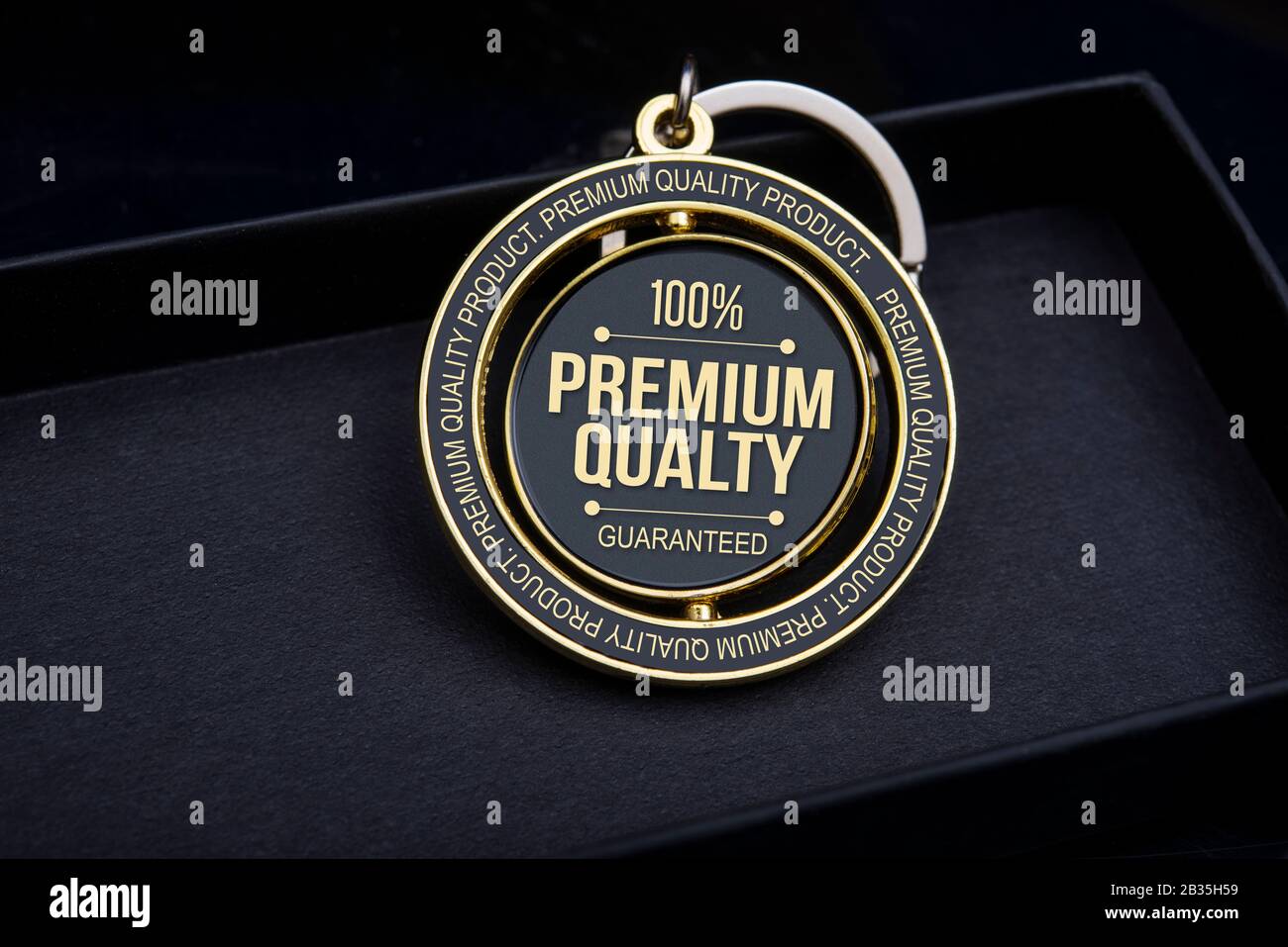 Testo del 100% di qualità premium garantita su badge e portachiavi Foto Stock